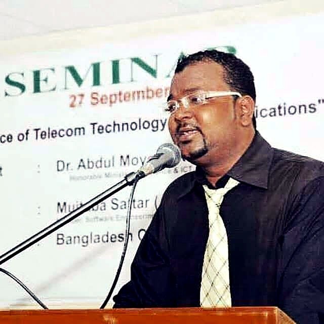 Mujtaba Sattar Anonto speaking at a lectern at a telecom technology seminar